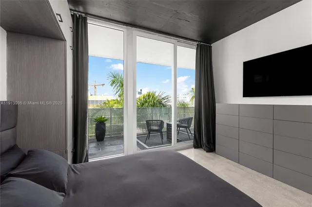 a view of a chair and table in the balcony