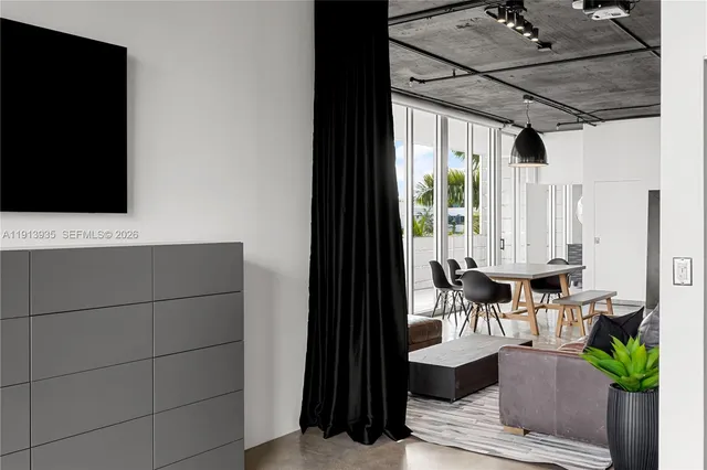 a view of front door with wooden floor