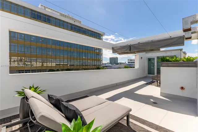 a view of balcony with furniture