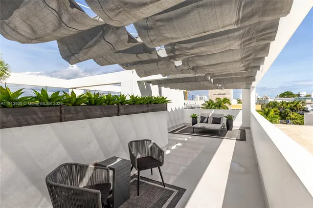 a view of balcony with furniture