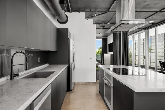 a kitchen with a table and chairs