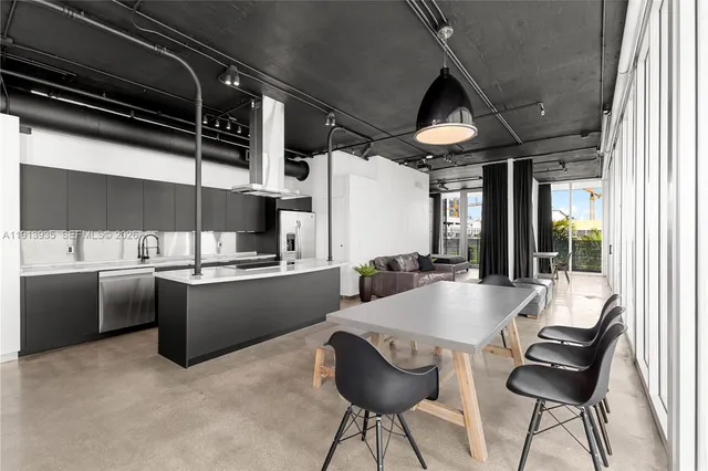 a kitchen with a table and chairs
