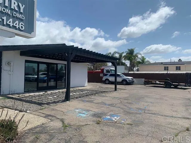 a view of house with outdoor space and seating area