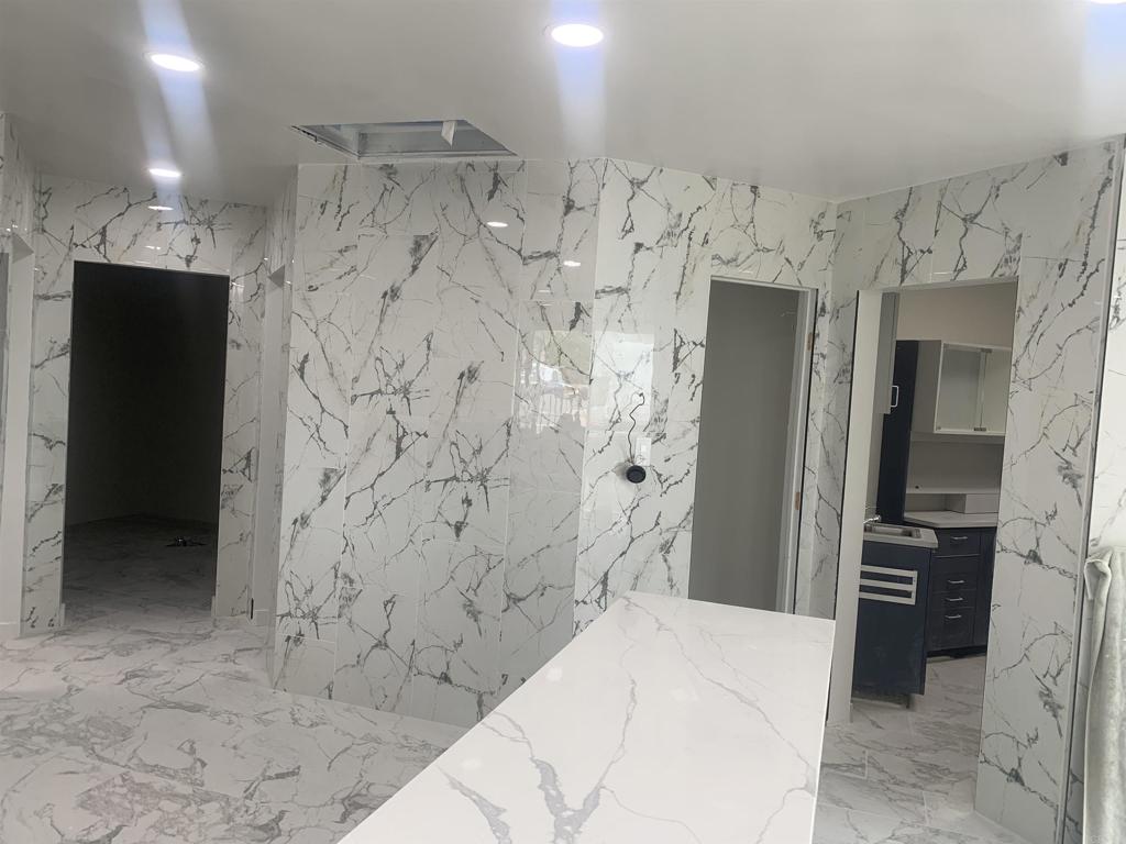 9325 Jamacha Boulevard Spring Valley, CA 91977 - Photo 8 of 9 a spacious bathroom with a shower and a sink