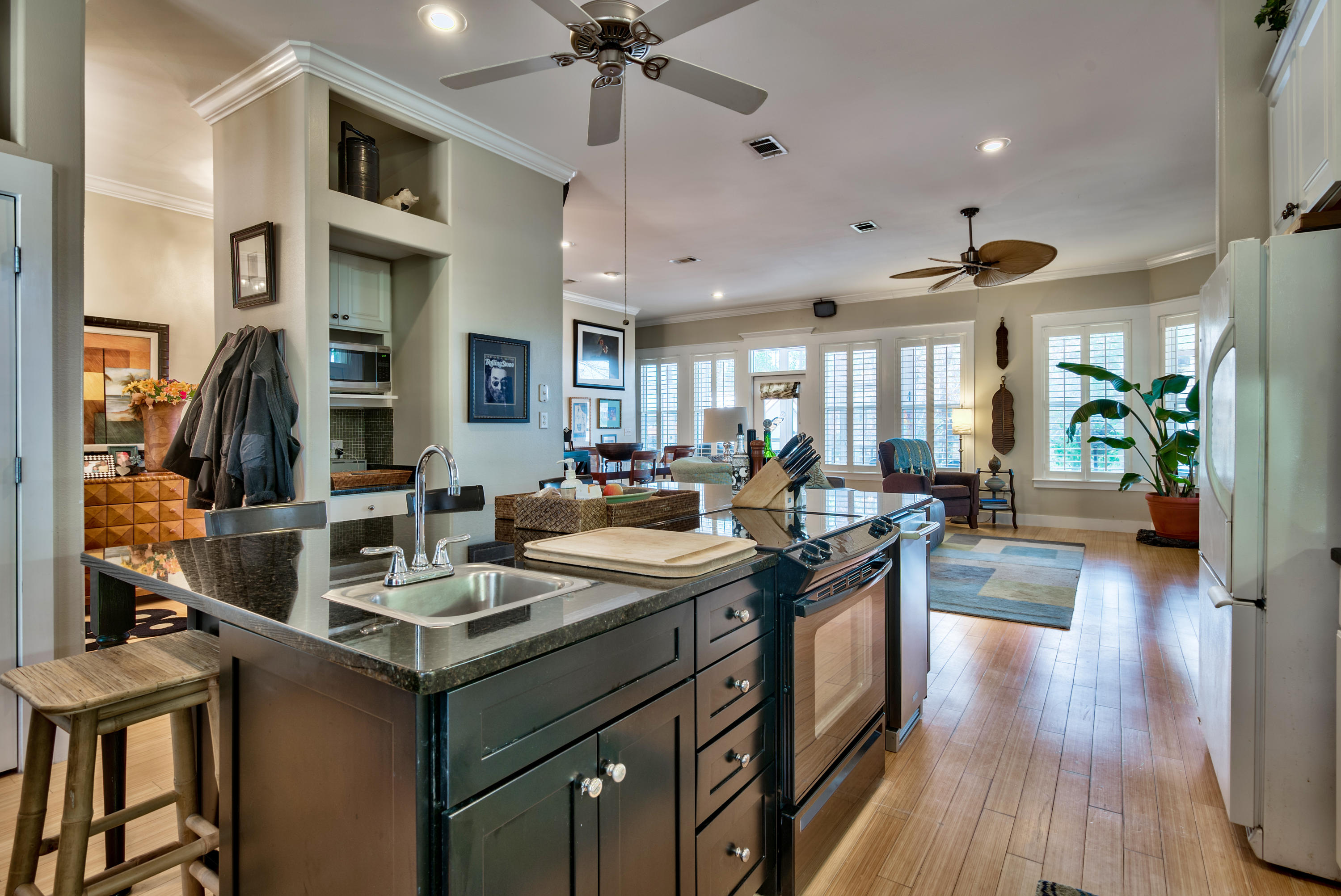 458 Bayou Circle Freeport, FL 32439 - Photo 19 of 33 a kitchen with stainless steel appliances granite countertop a sink a stove and a wooden floors