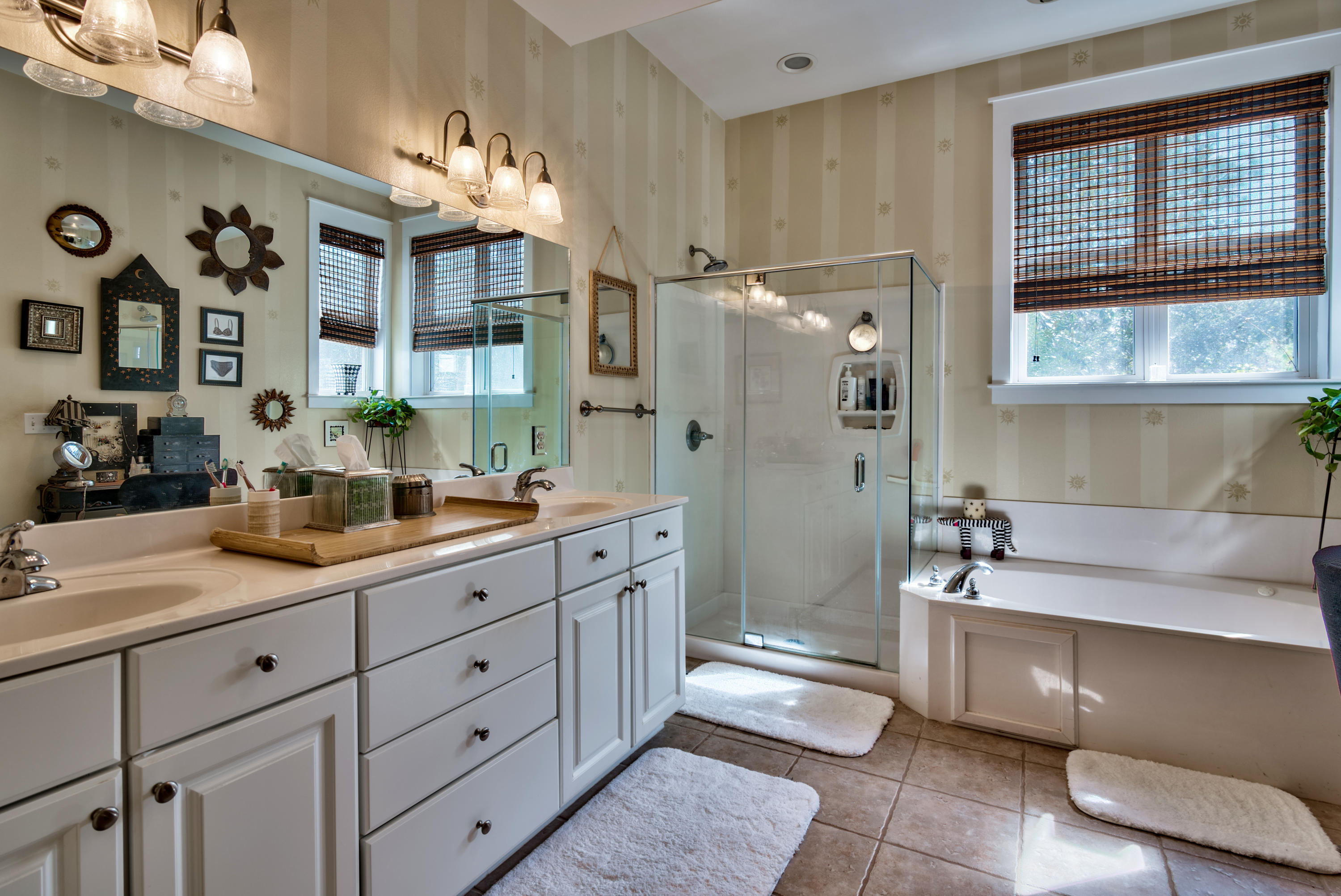 458 Bayou Circle Freeport, FL 32439 - Photo 22 of 33 a spacious bathroom with a granite countertop sink mirror and bathtub