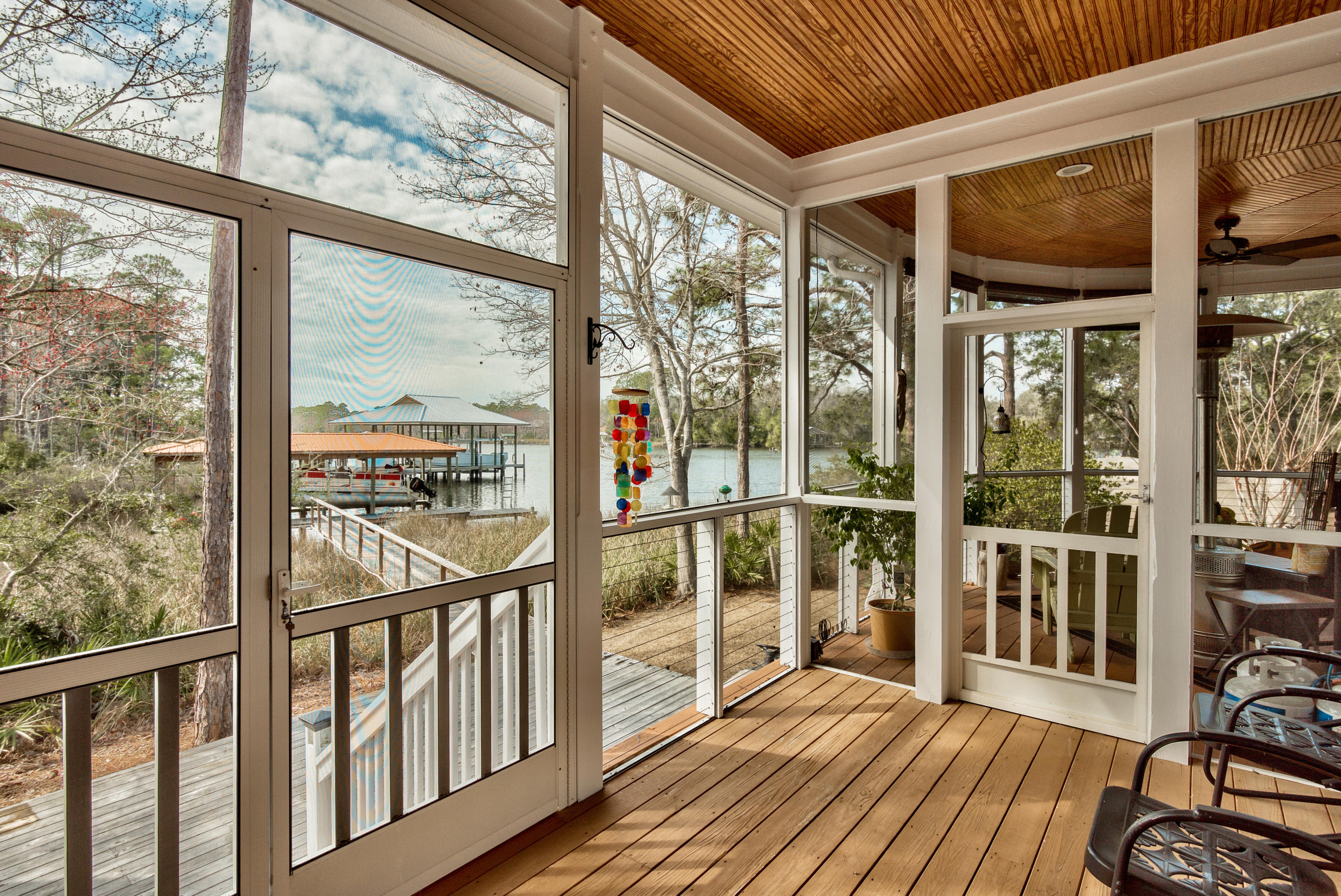 458 Bayou Circle Freeport, FL 32439 - Photo 6 of 33 a view of a room with wooden floor and iron stairs