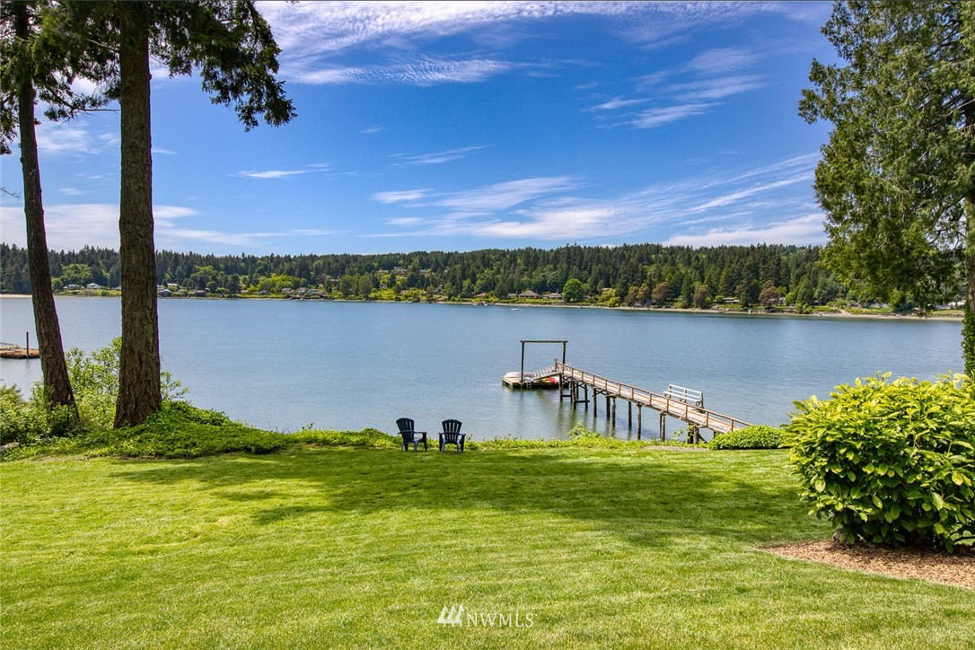 21005 Indianola Road Northeast Poulsbo, WA 98370 - Photo 2 of 40 a view of a lake with a garden