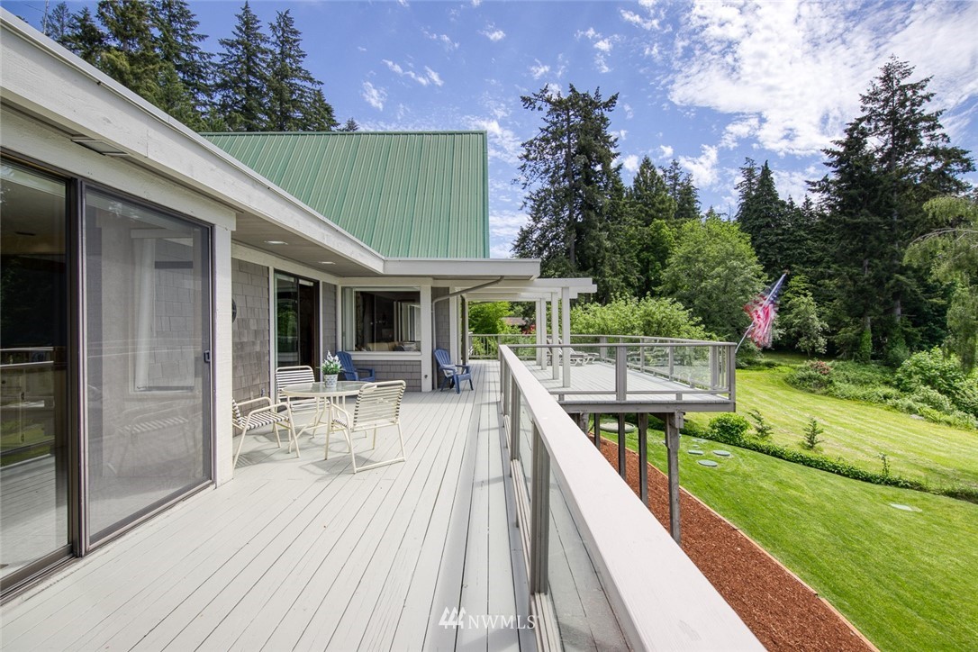 21005 Indianola Road Northeast Poulsbo, WA 98370 - Photo 13 of 40 swimming pool view with a seating space and a garden view