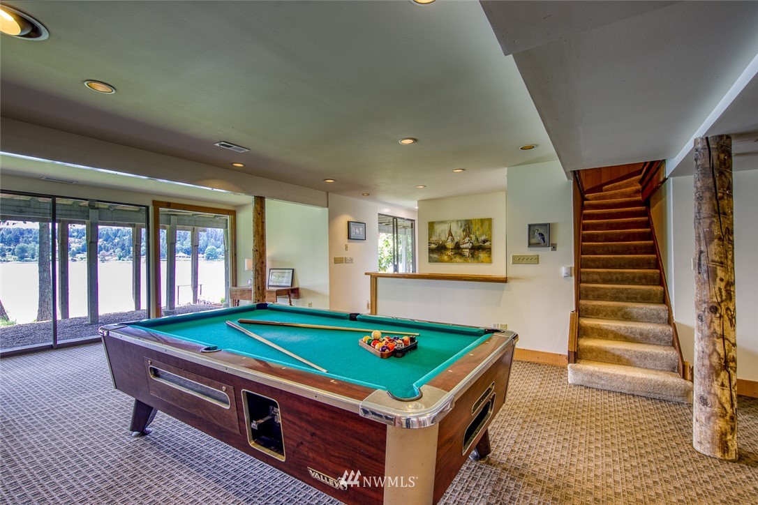 21005 Indianola Road Northeast Poulsbo, WA 98370 - Photo 26 of 40 a room with pool table and windows