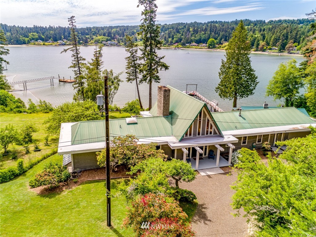 21005 Indianola Road Northeast Poulsbo, WA 98370 - Photo 35 of 40 an aerial view of a house with outdoor space and lake view