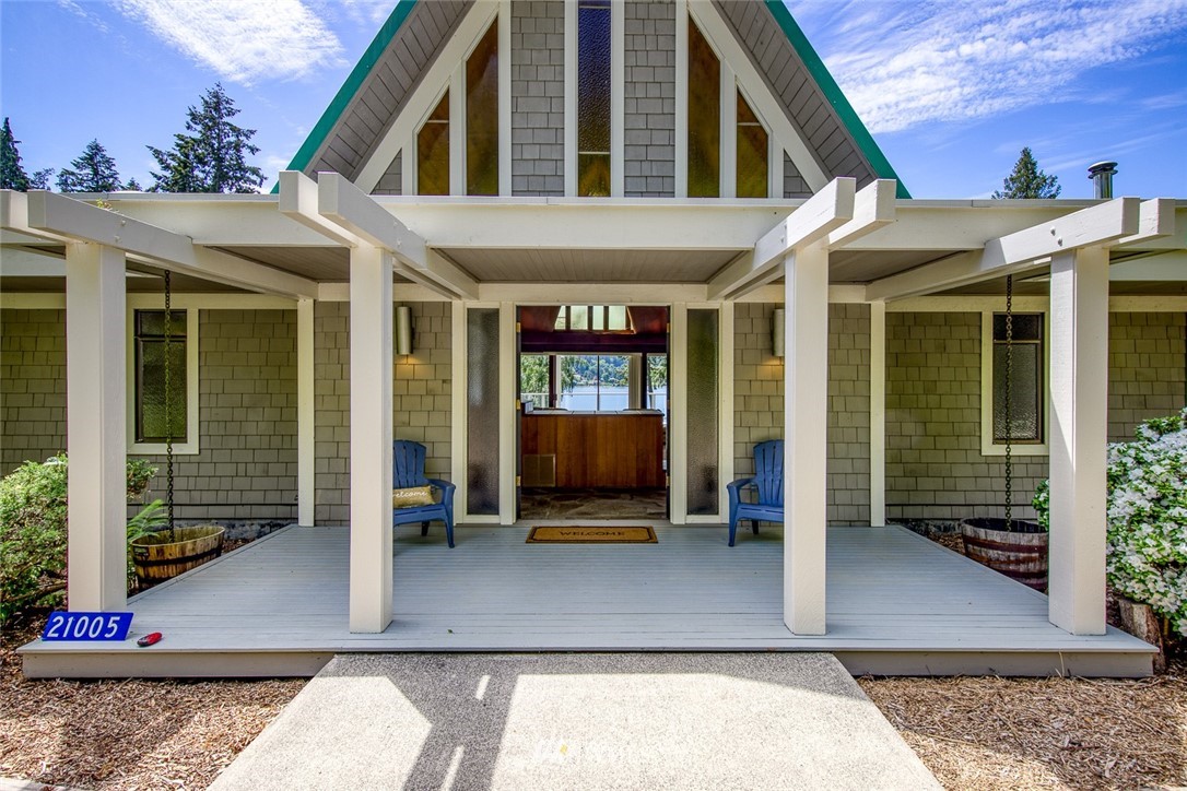 21005 Indianola Road Northeast Poulsbo, WA 98370 - Photo 5 of 40 a view of a building with door
