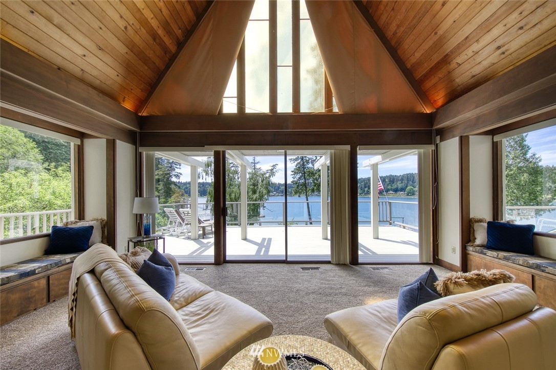 21005 Indianola Road Northeast Poulsbo, WA 98370 - Photo 7 of 40 a living room with furniture and a large window