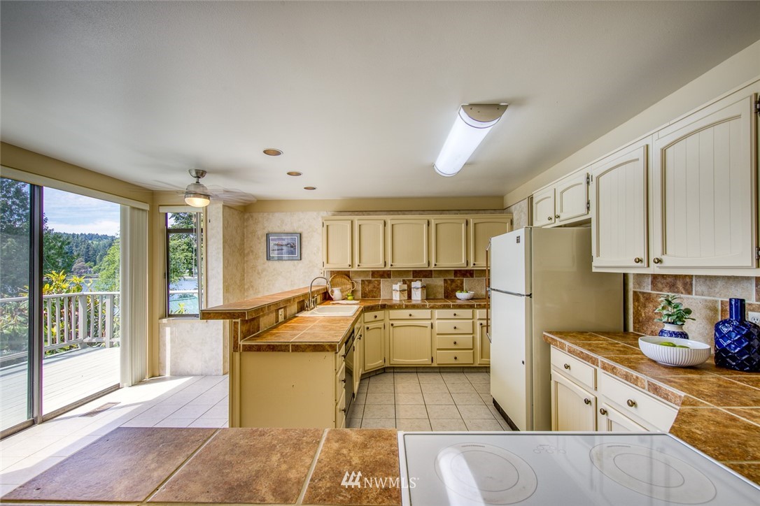 21005 Indianola Road Northeast Poulsbo, WA 98370 - Photo 10 of 40 a living room with stainless steel appliances granite countertop furniture and a kitchen view