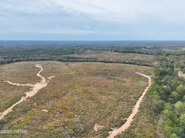 an aerial view of beach and residential space