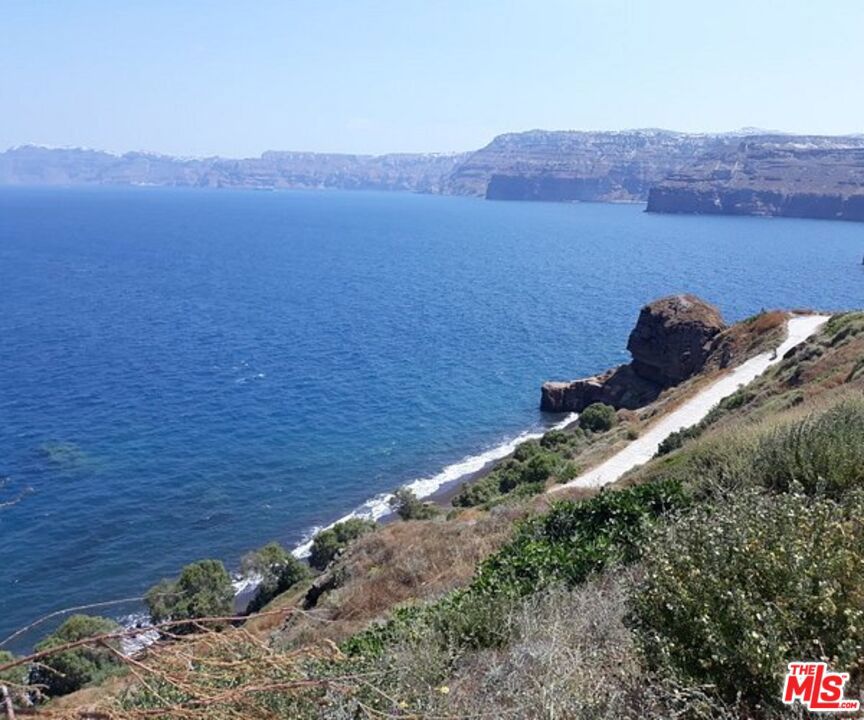 10 Santorini Greece undefined, undefined 0 - Photo 6 of 10 a view of a lake with mountains in the background