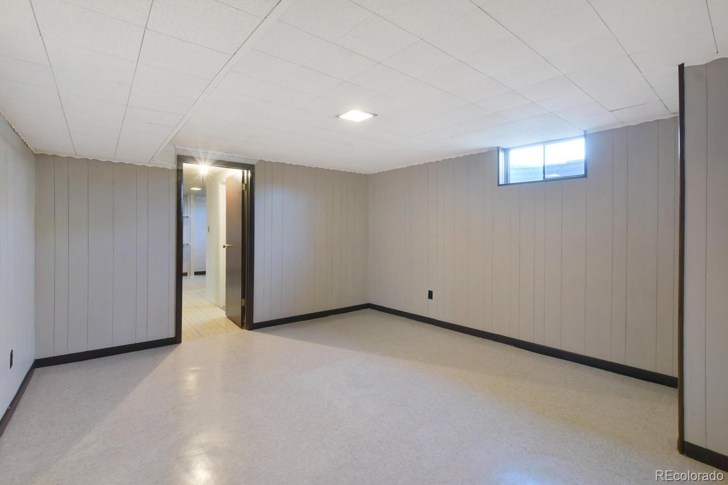 4660 Quay Street Wheat Ridge, CO 80033 - Photo 16 of 37 a view of an empty room and window