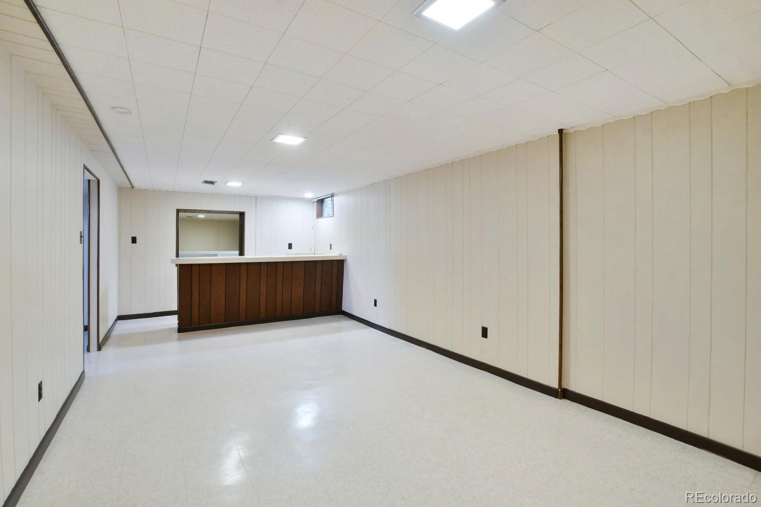 4660 Quay Street Wheat Ridge, CO 80033 - Photo 17 of 37 a view of an empty room with a cabinet