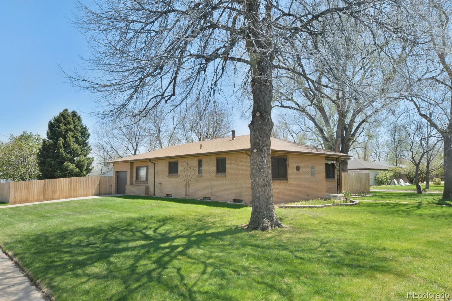 4660 Quay Street Wheat Ridge, CO 80033 - Photo 3 of 37 a view of house with backyard