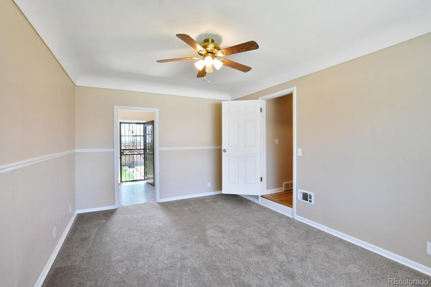 4660 Quay Street Wheat Ridge, CO 80033 - Photo 8 of 37 an empty room with closet and windows
