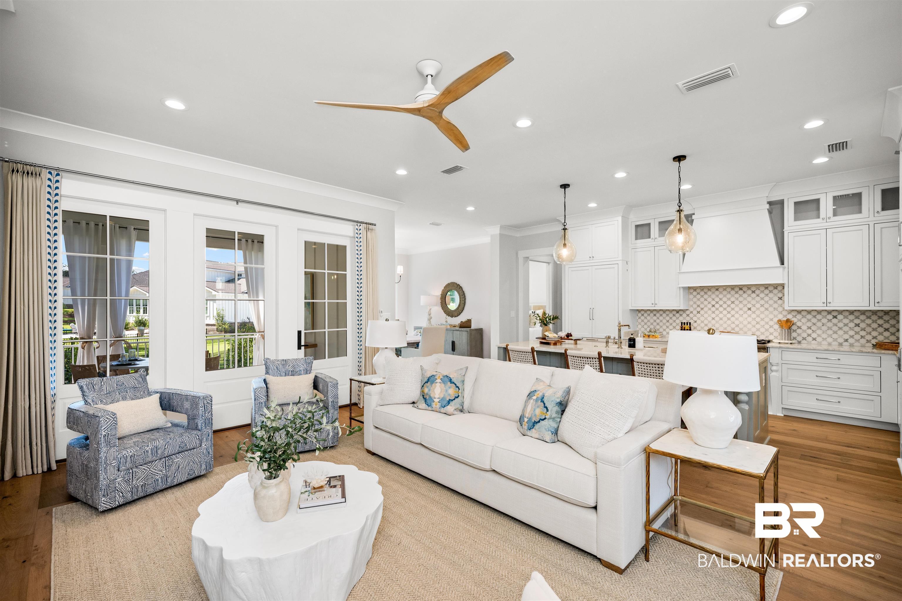 156 Hyacinth Street Fairhope, AL 36532 - Photo 6 of 61 Living room with light wood-style flooring, a ceiling fan, crown molding, and recessed lighting