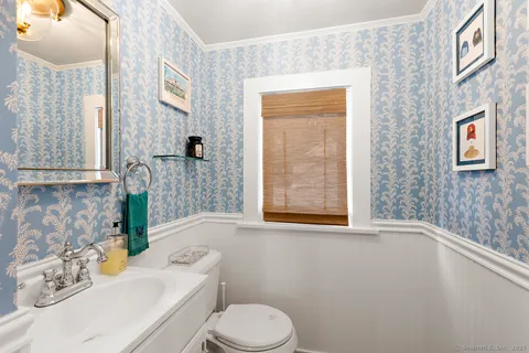 a bathroom with a sink a toilet and tub