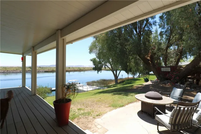 a sitting area with furniture and view of lake
