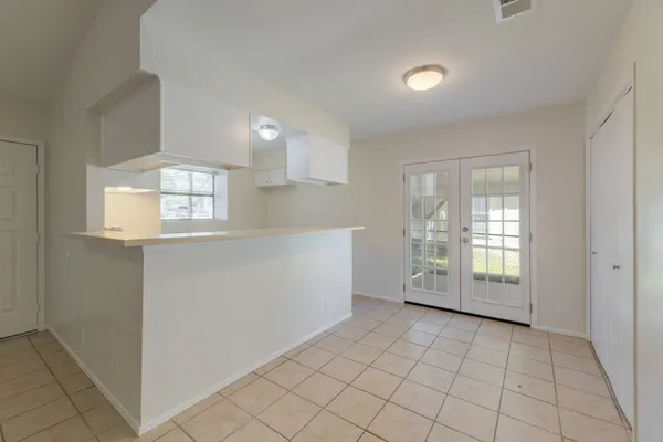 a view of an empty room and window