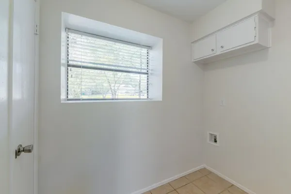 a view of a room that has a window in it