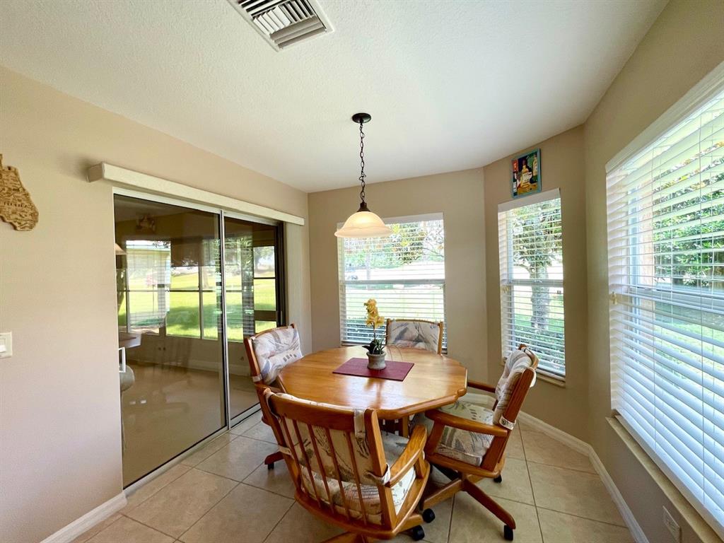 16026 Southwest 14th Avenue Road Ocala, FL 34473 - Photo 37 of 79 a dining room with furniture and window