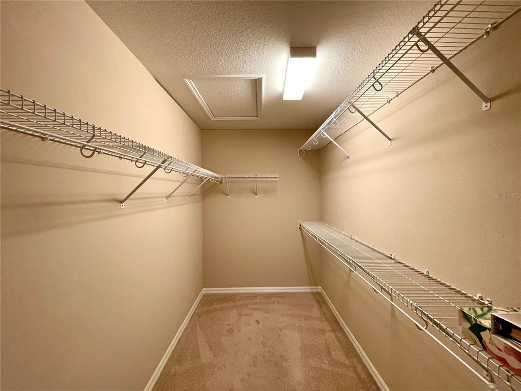 16026 Southwest 14th Avenue Road Ocala, FL 34473 - Photo 51 of 79 a view of a room with racks on the wall