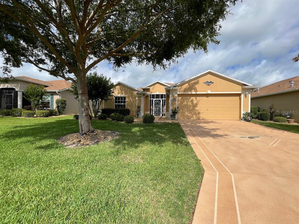 16026 Southwest 14th Avenue Road Ocala, FL 34473 - Photo 59 of 79 a front view of a house with a yard