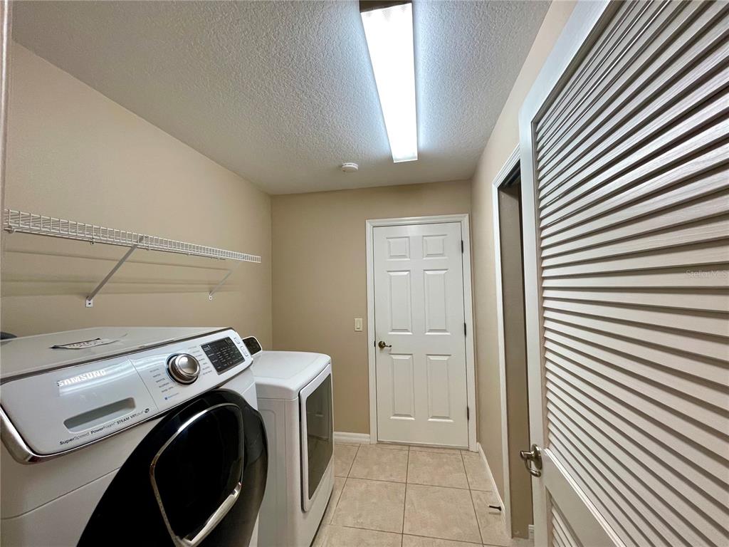 16026 Southwest 14th Avenue Road Ocala, FL 34473 - Photo 77 of 79 a utility room with dryer and washer