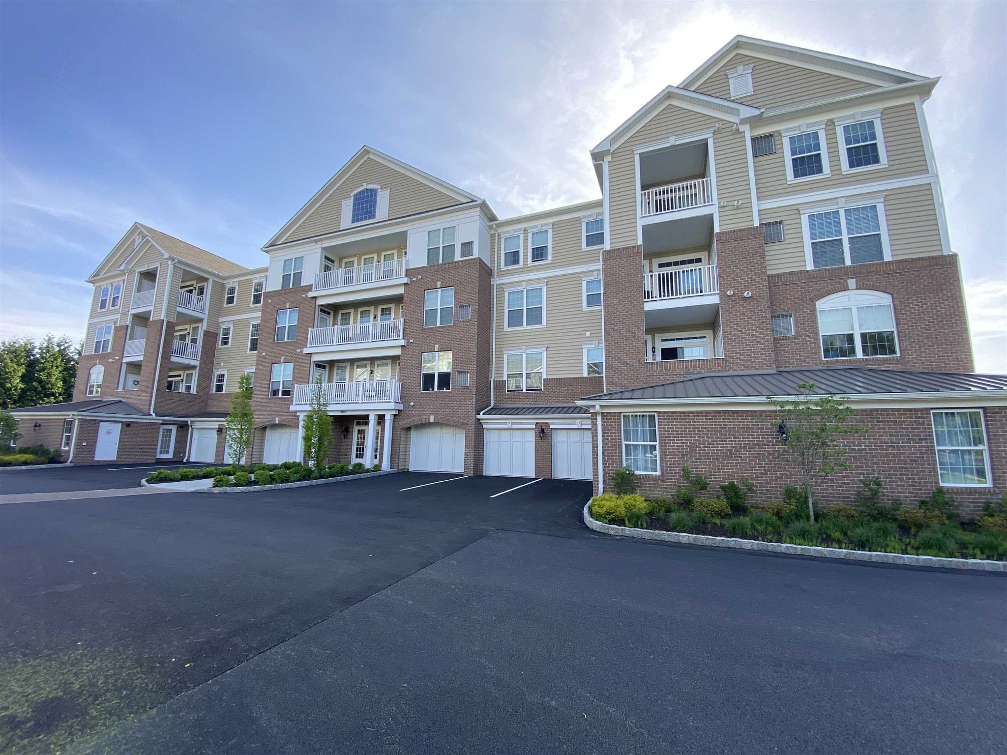 643 Regency Drive Fishkill, NY 12524 - Photo 1 of 37 a front view of a building with a street