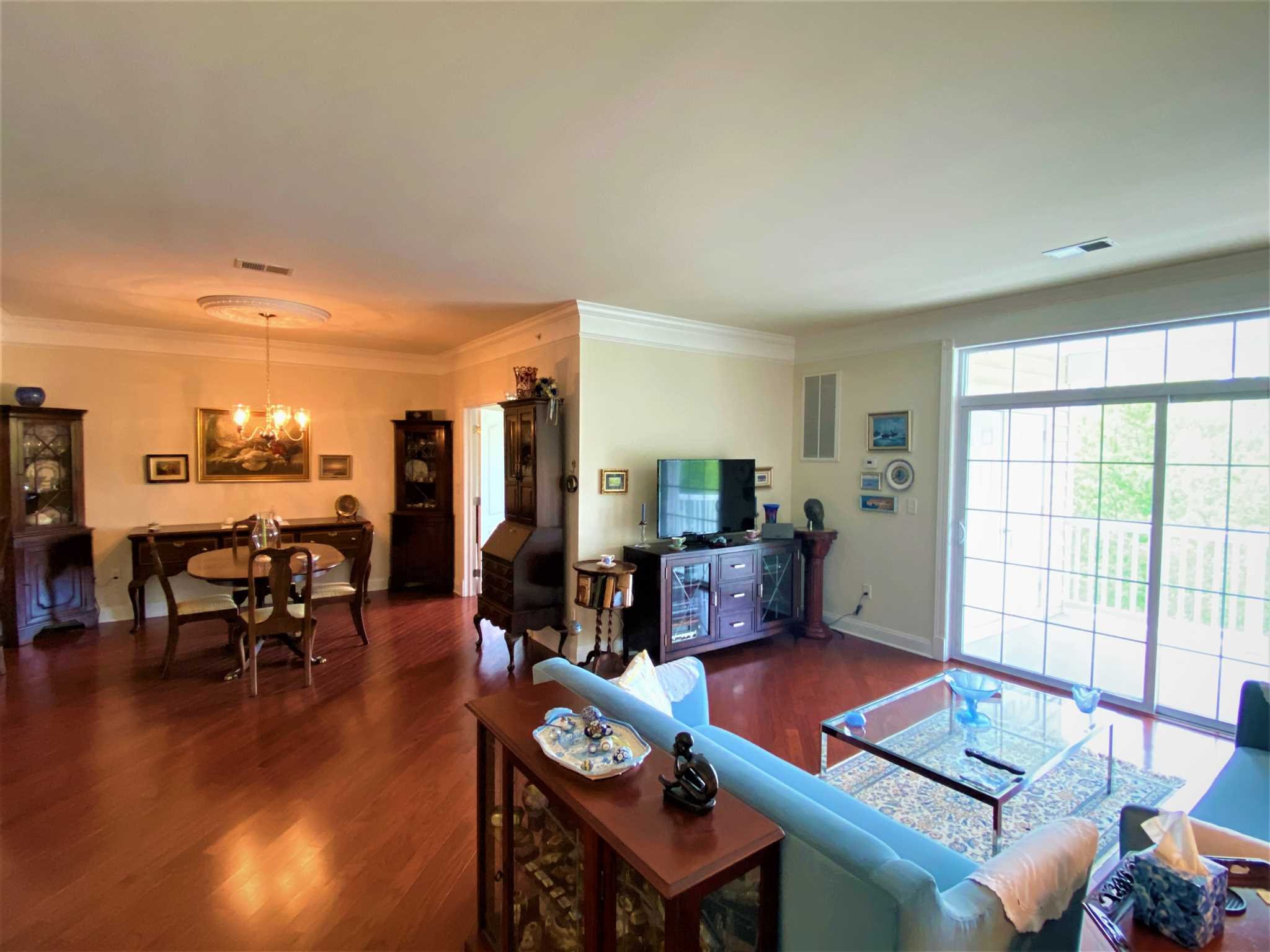 643 Regency Drive Fishkill, NY 12524 - Photo 13 of 37 a living room with furniture a flat screen tv and a large window