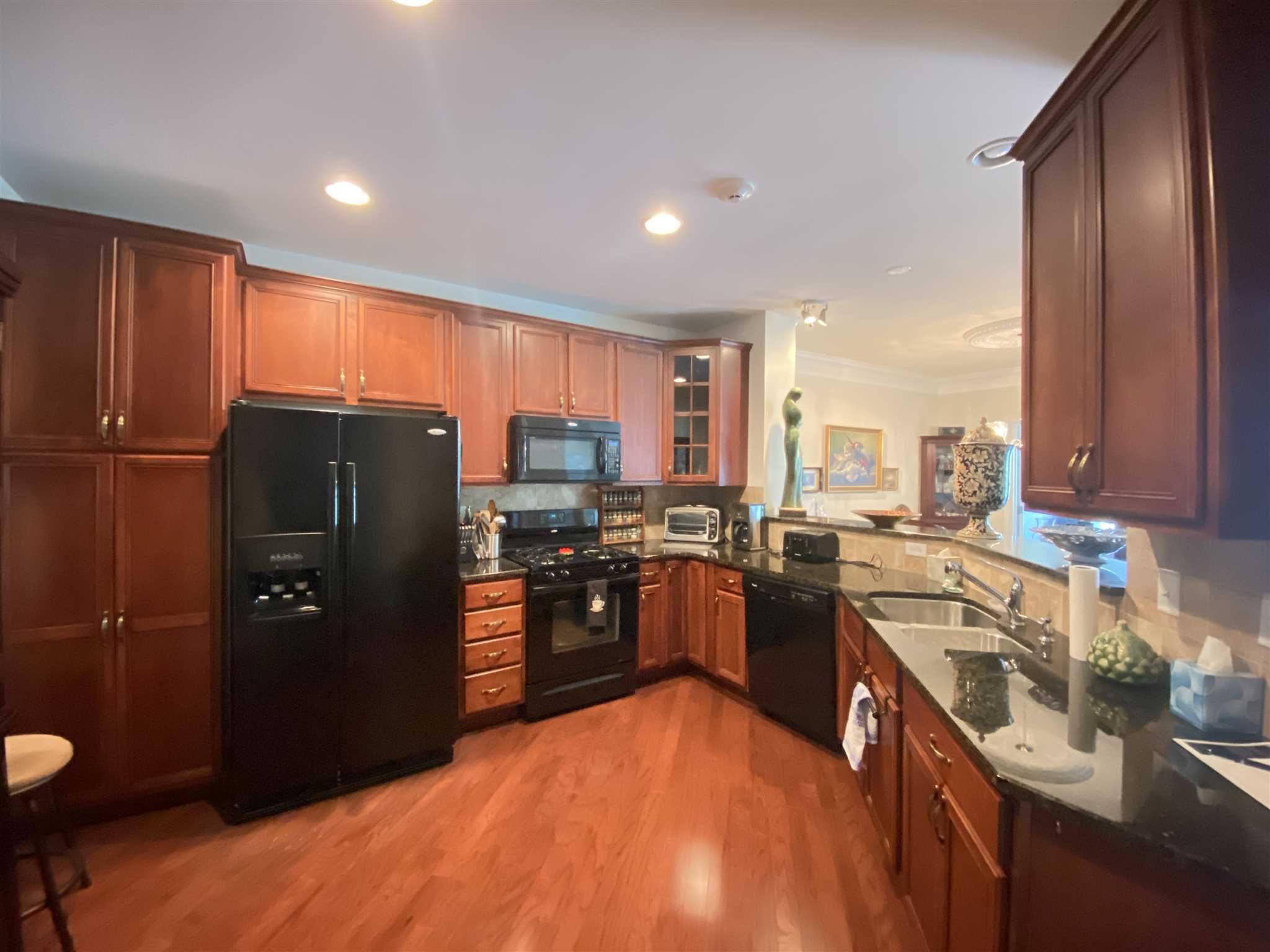 643 Regency Drive Fishkill, NY 12524 - Photo 15 of 37 a kitchen with stainless steel appliances granite countertop a refrigerator a stove a sink dishwasher and a microwave