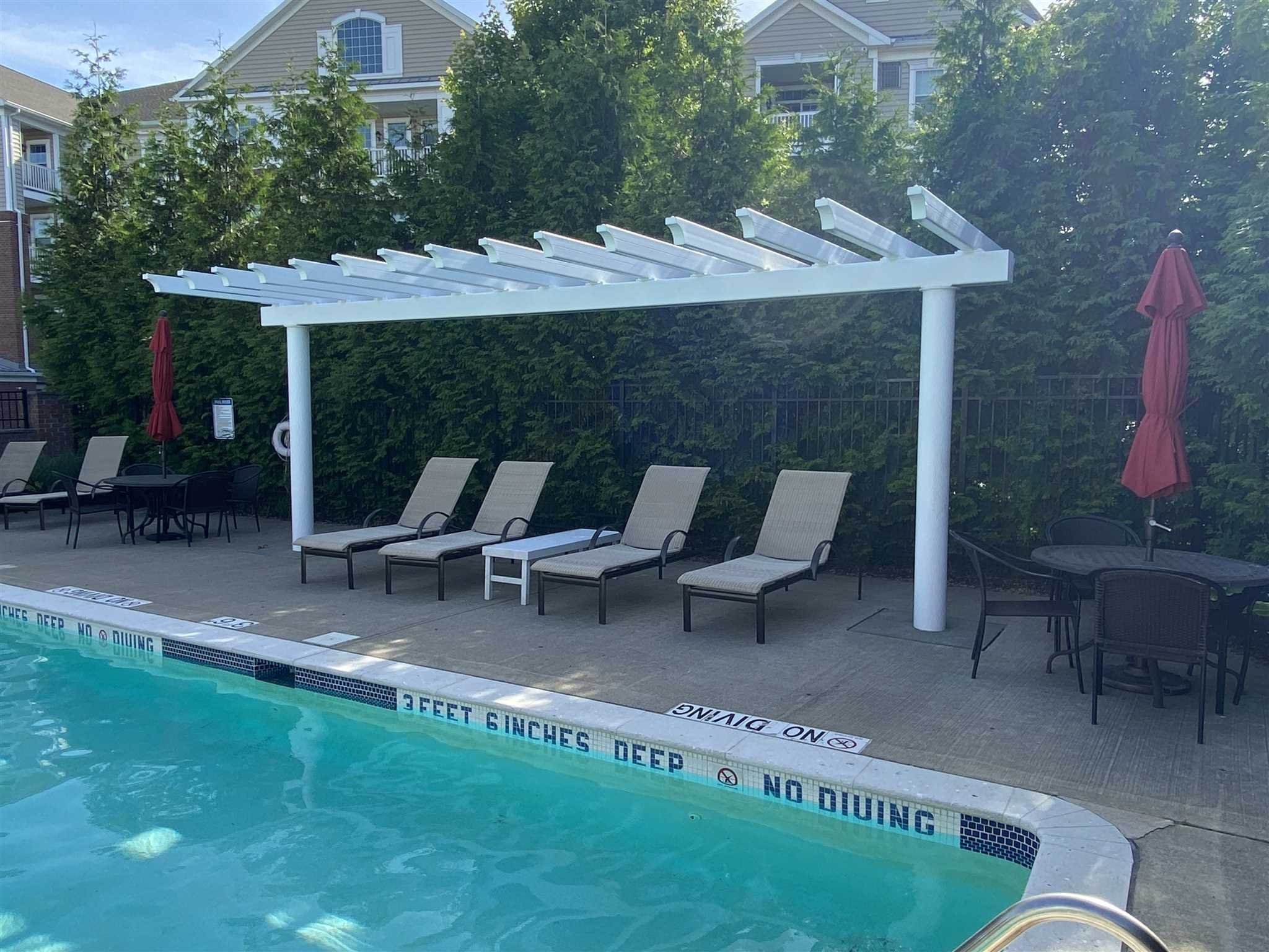643 Regency Drive Fishkill, NY 12524 - Photo 35 of 37 a view of a patio with table and chairs and potted plants