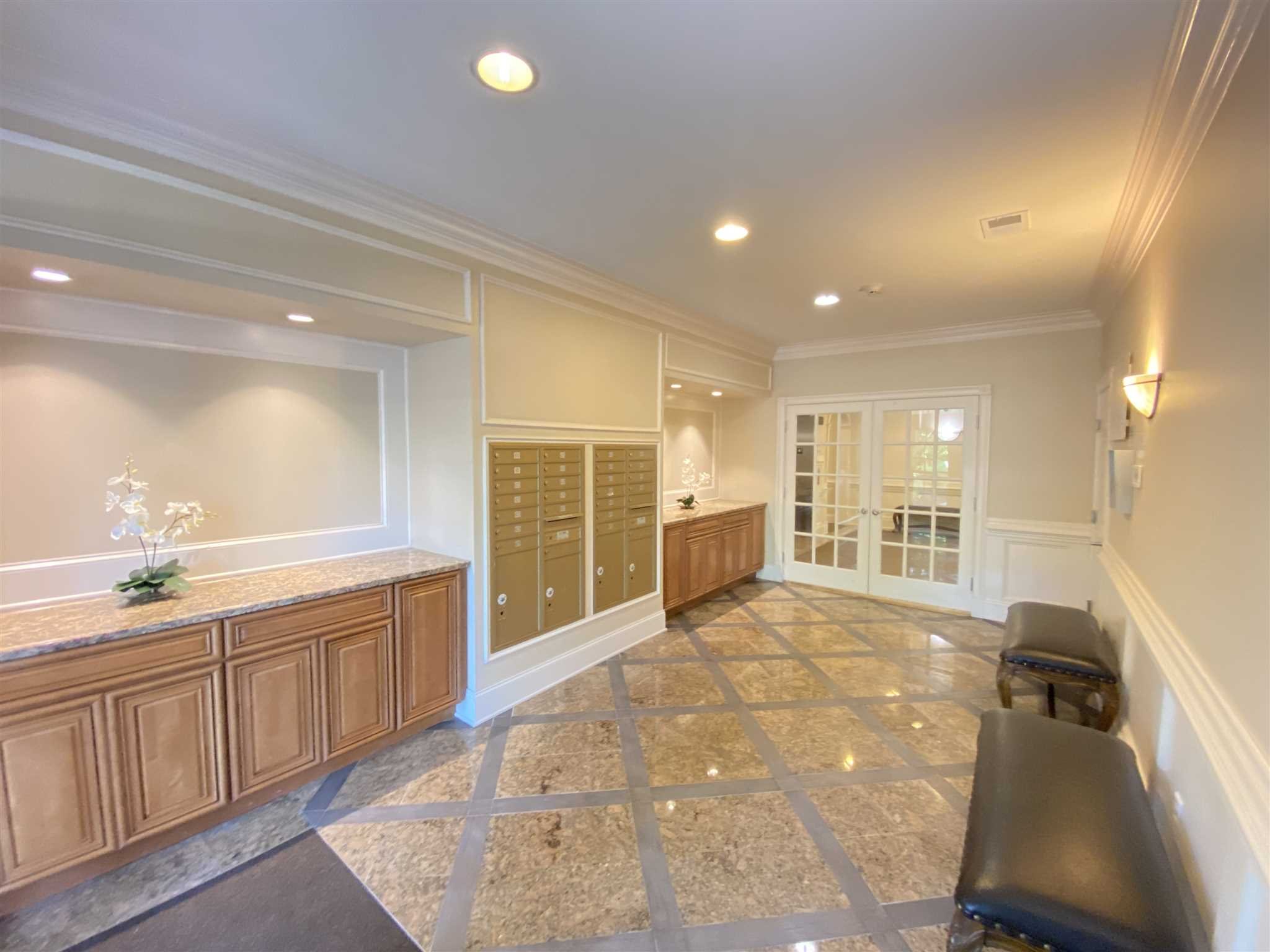 643 Regency Drive Fishkill, NY 12524 - Photo 7 of 37 a large hall with stainless steel appliances granite countertop a sink and cabinets