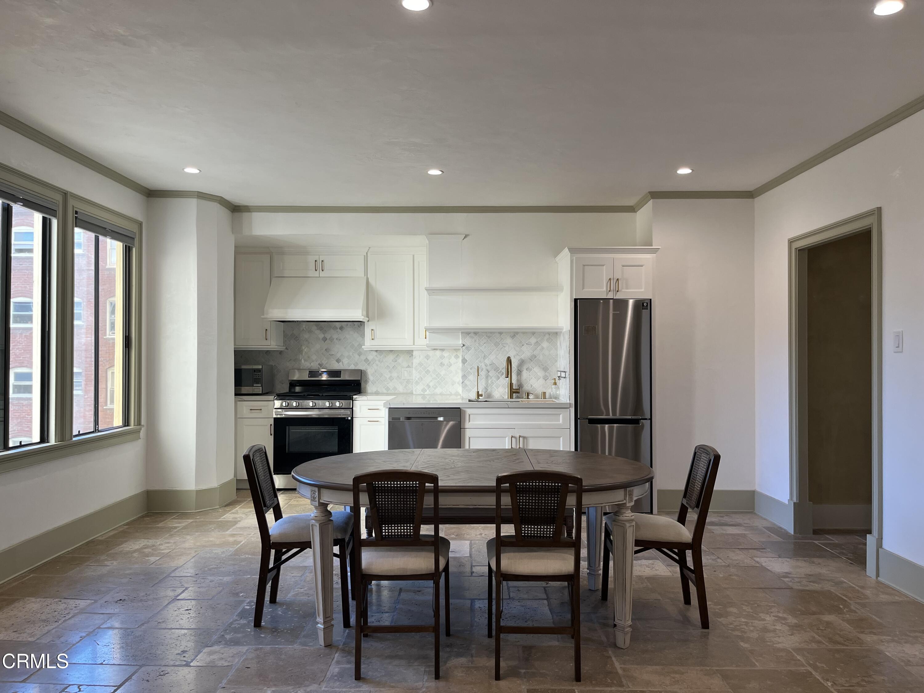 315 West 3rd Street, Unit 301 Long Beach, CA 90802 - Photo 3 of 15 a dining room with furniture and window