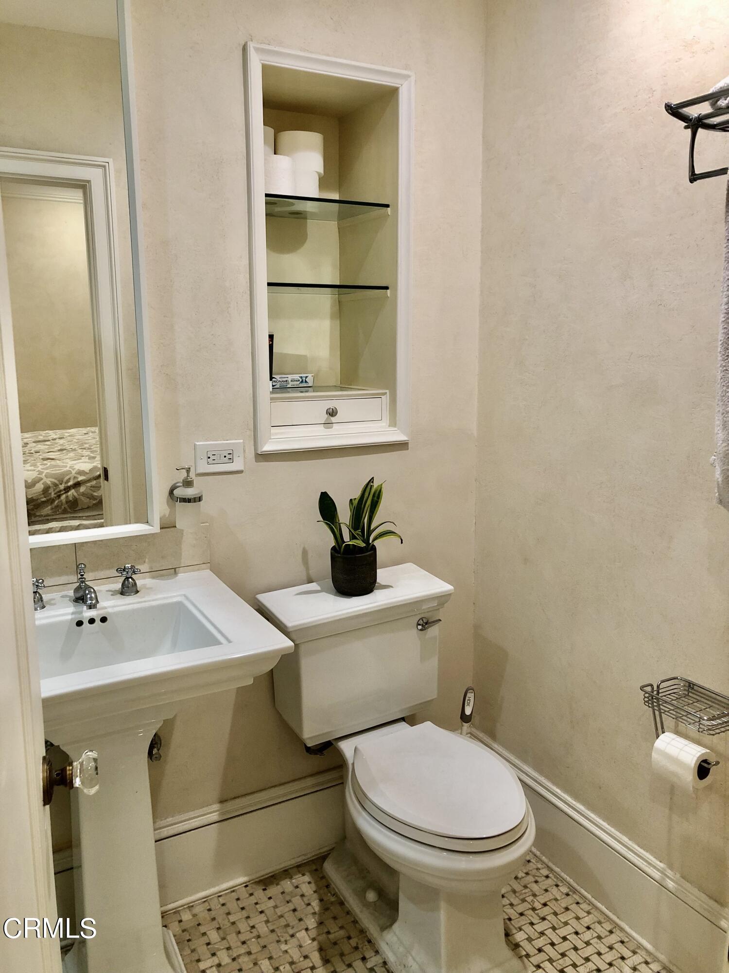 315 West 3rd Street, Unit 301 Long Beach, CA 90802 - Photo 6 of 15 a bathroom with a sink toilet and mirror