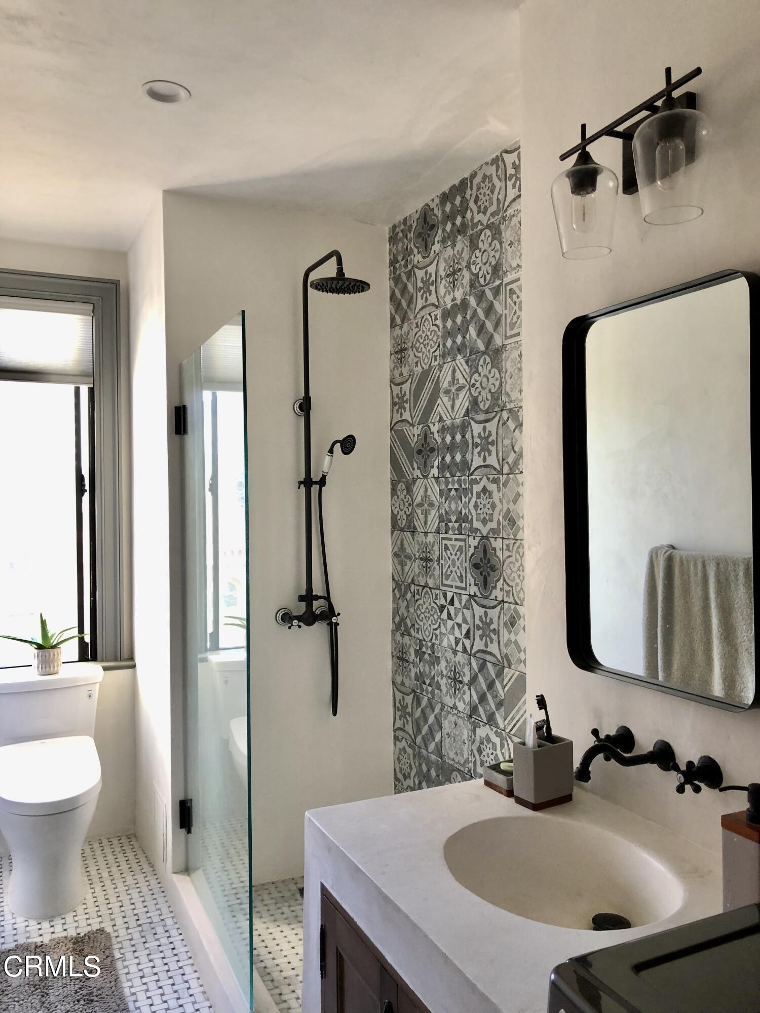 315 West 3rd Street, Unit 301 Long Beach, CA 90802 - Photo 9 of 15 a bathroom with a sink toilet and shower