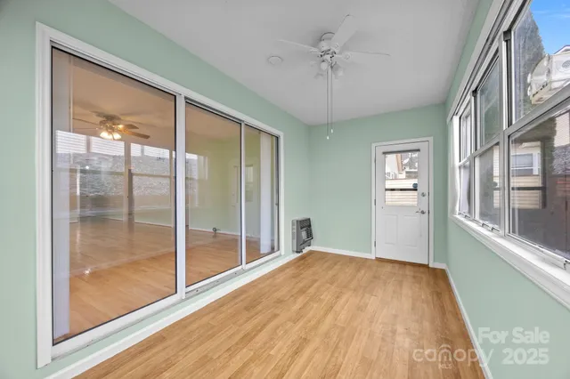 a view of a room with a large window