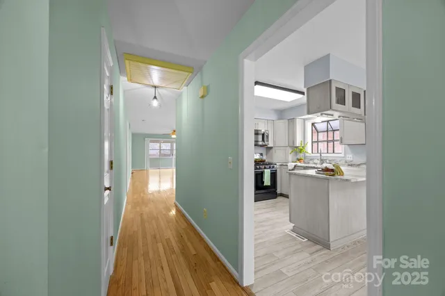 a view of a kitchen from the hallway