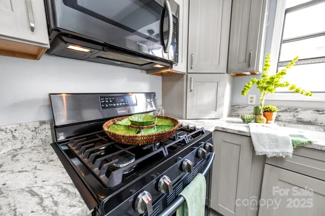a kitchen with table and chairs