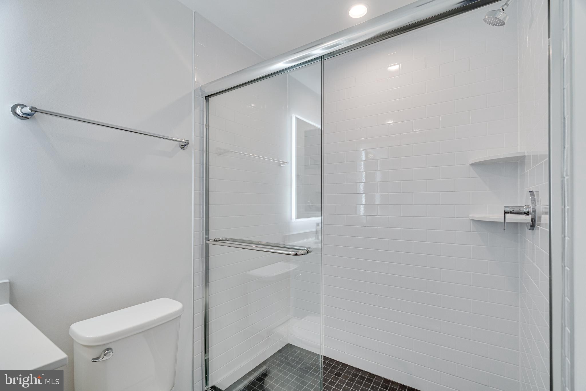 2070 Tysons Ridgeline Road Falls Church, VA 22043 - Photo 13 of 57 a bathroom with a shower and toilet