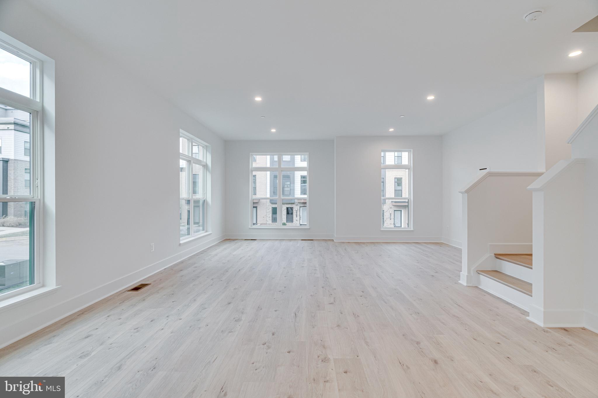 2070 Tysons Ridgeline Road Falls Church, VA 22043 - Photo 15 of 57 a view of an empty room with a window and wooden floor