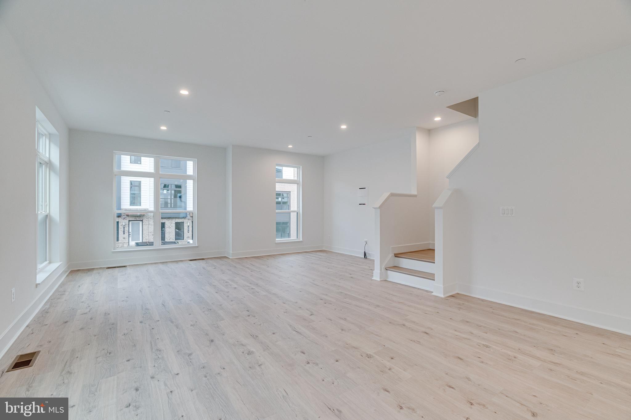 2070 Tysons Ridgeline Road Falls Church, VA 22043 - Photo 16 of 57 a view of an empty room with wooden floor and a window