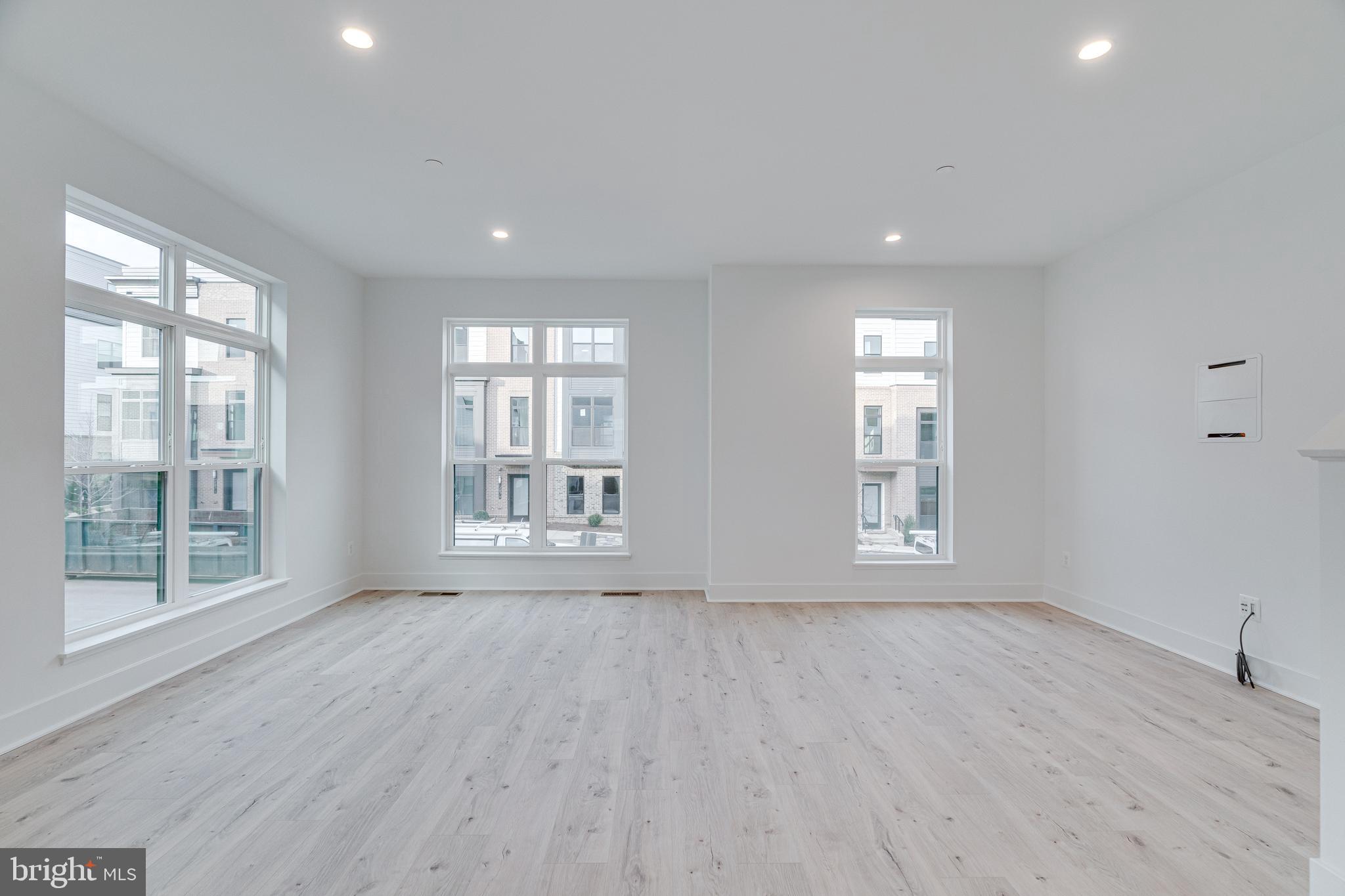2070 Tysons Ridgeline Road Falls Church, VA 22043 - Photo 17 of 57 a view of an empty room with wooden floor and a window