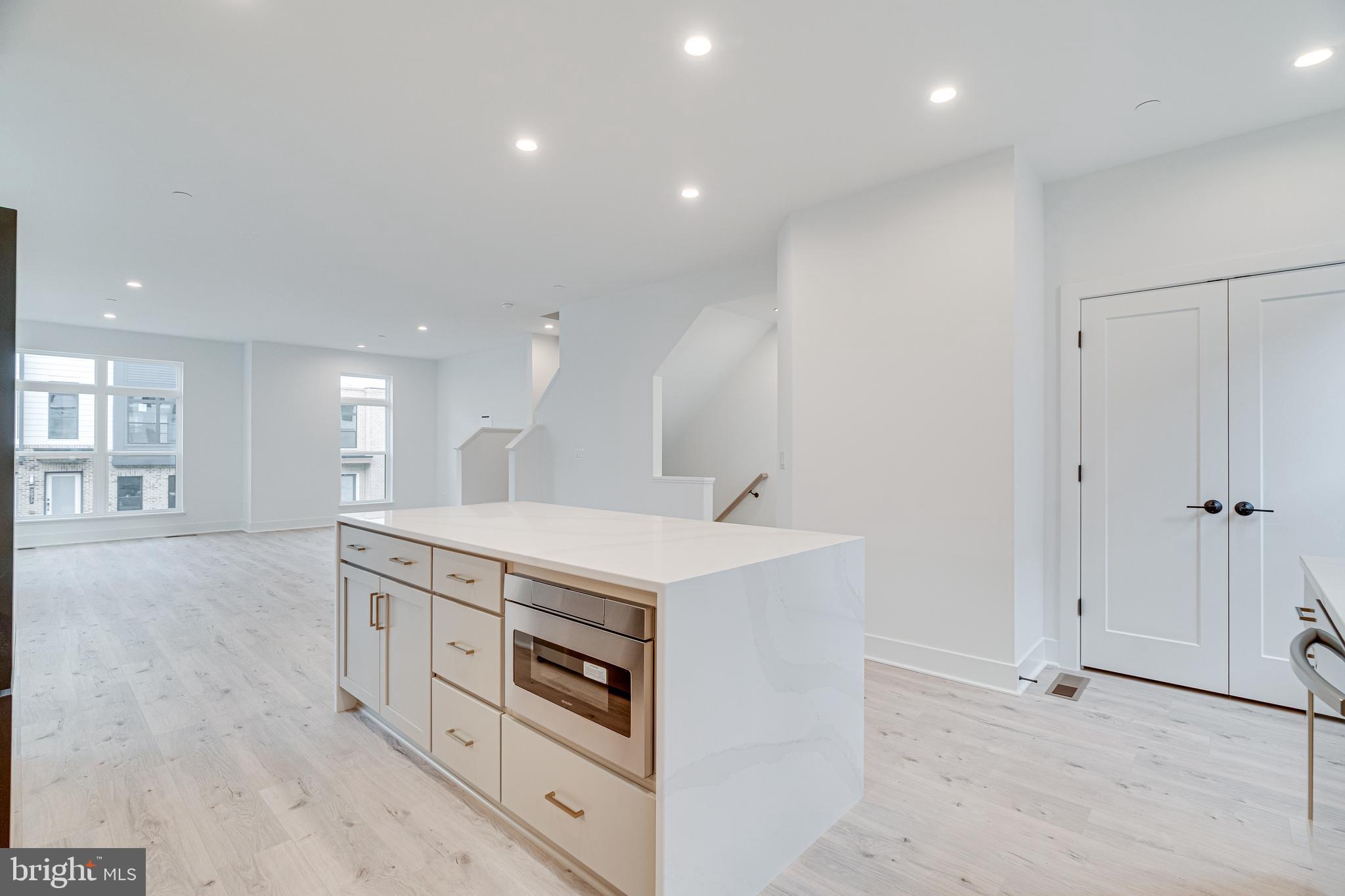 2070 Tysons Ridgeline Road Falls Church, VA 22043 - Photo 24 of 57 a kitchen with stainless steel appliances granite countertop a stove and a refrigerator