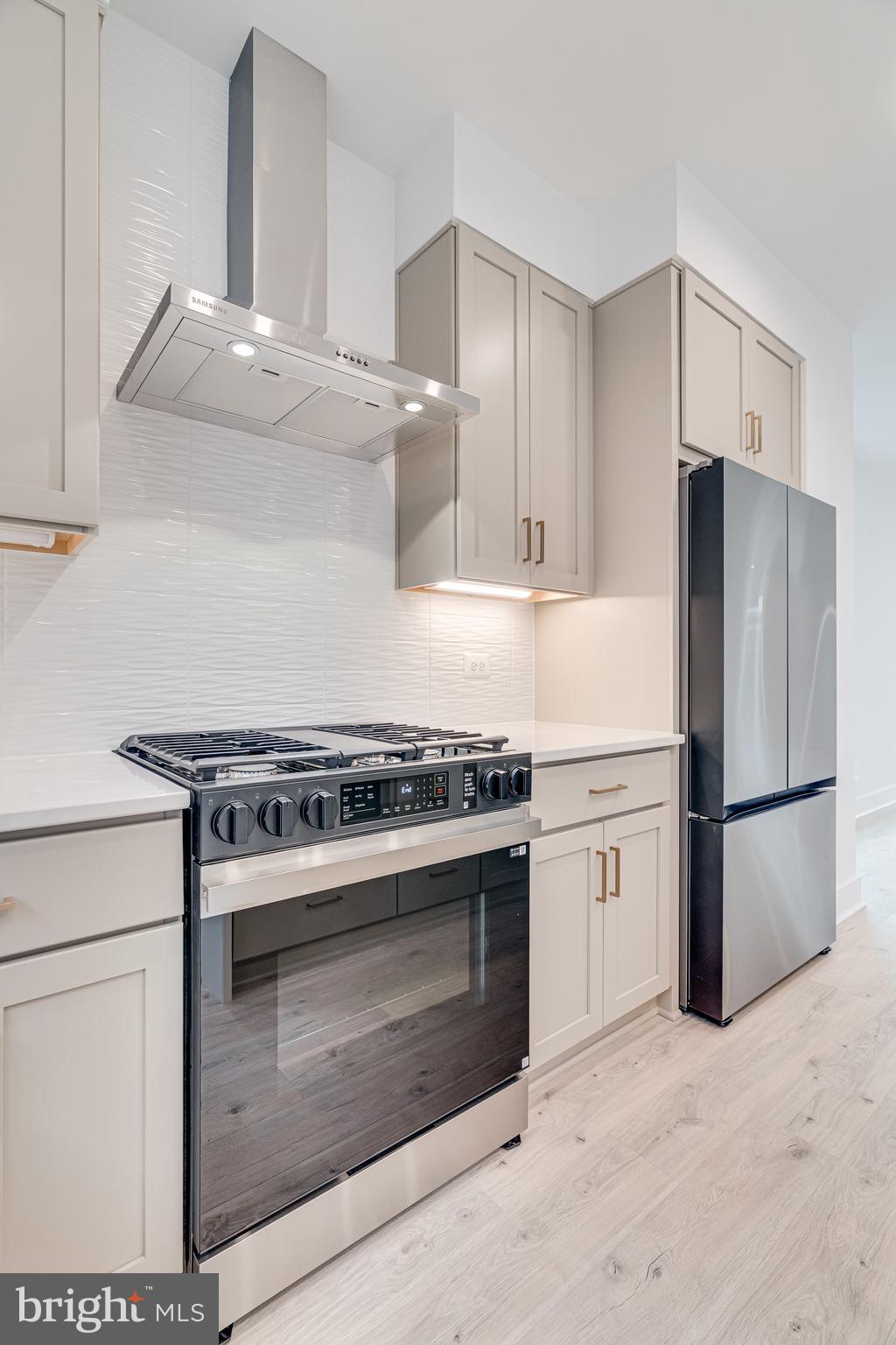 2070 Tysons Ridgeline Road Falls Church, VA 22043 - Photo 26 of 57 a kitchen with a stove and a refrigerator